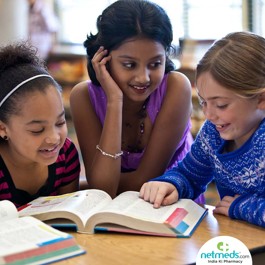 Girls reading books together