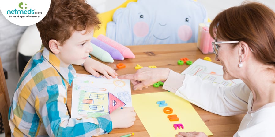 Teacher teaching an autistic child