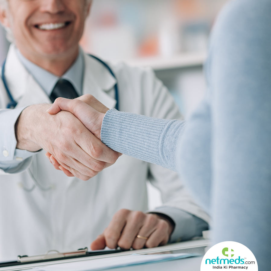 Doctor shaking hands with patient