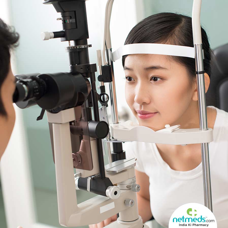 Doctor checking a girl's eye