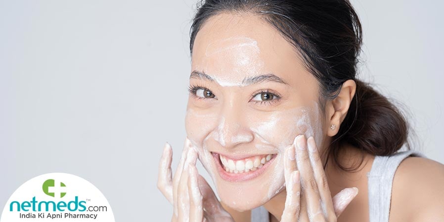 Woman using facial cleanser