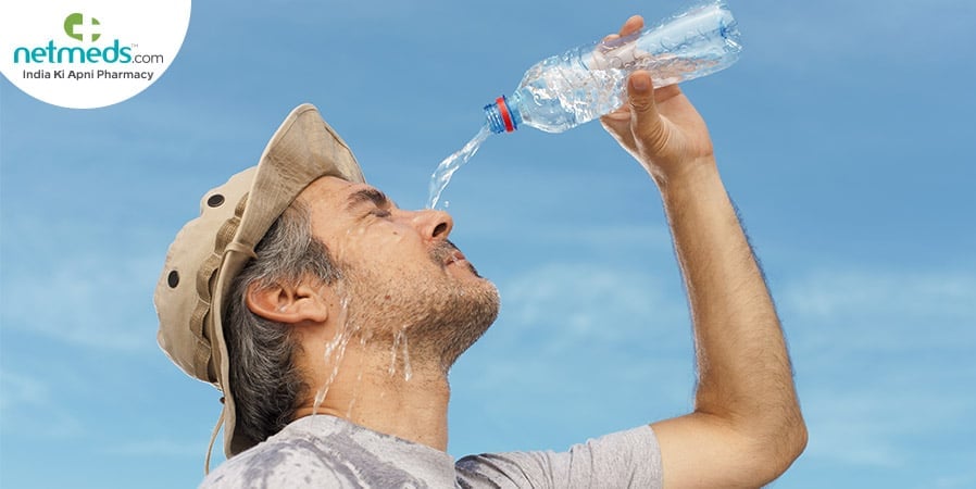 Woman pouring water on his face to avoid heat exhaustion