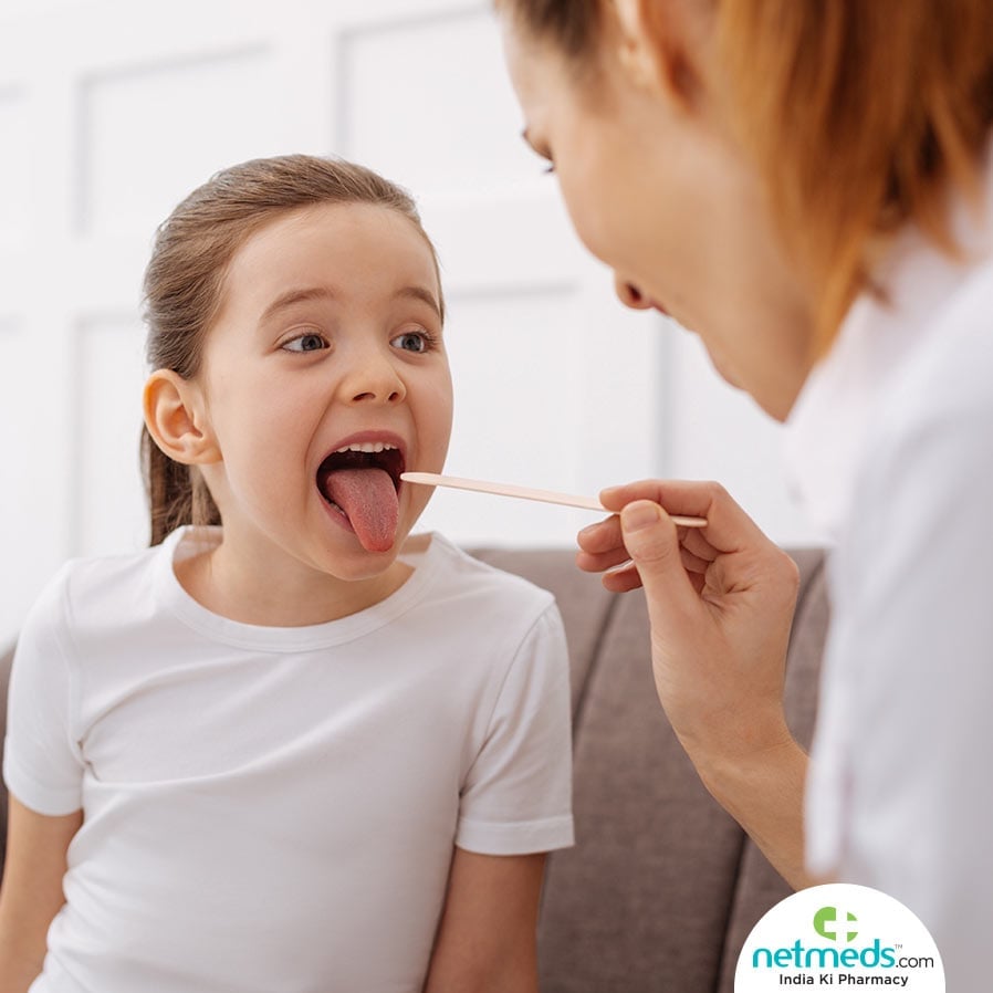 Doctor Checking The Tongue Colour of a kid