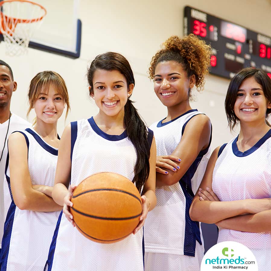 Adolescent girls with basket ball