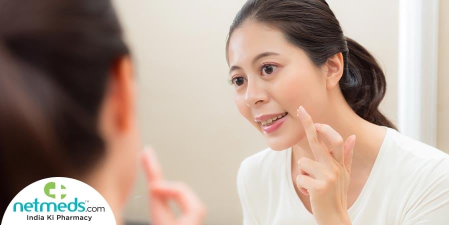 woman applying night cream