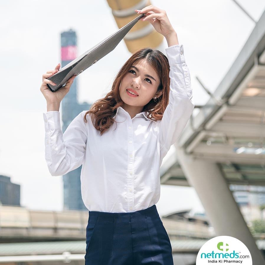 A girl protecting herself from sunrays with a file